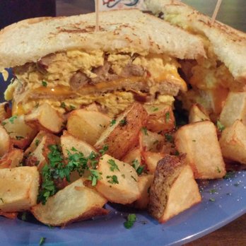 Squeeze In - Breakfast sandwich with turkey sausage, cheddar cheese and eggs on sourdough bread and home fries. - Breakfast & Brunch Near Me - Sparks, Nevada Squeeze In - Breakfast sandwich with turkey sausage, cheddar cheese and eggs on sourdough bread and home fries. - Breakfast & Brunch Near Me - Sparks, Nevada