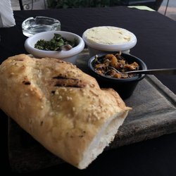 Al Pie del Carbon - Grilled bread with garlic butter, habanero sauce, and chimmi churri sauce