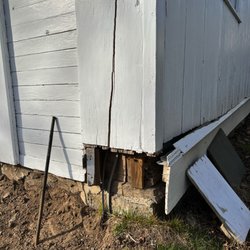 Raccoon Landscaping - This is the corner of my barn that was damaged by Raccoon Brothers.