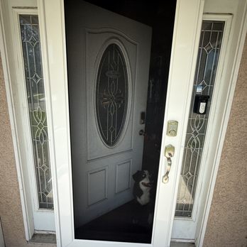 Den Defenders Security Doors - Security screen door with front door slightly open - Door Sales/Installation Near Me