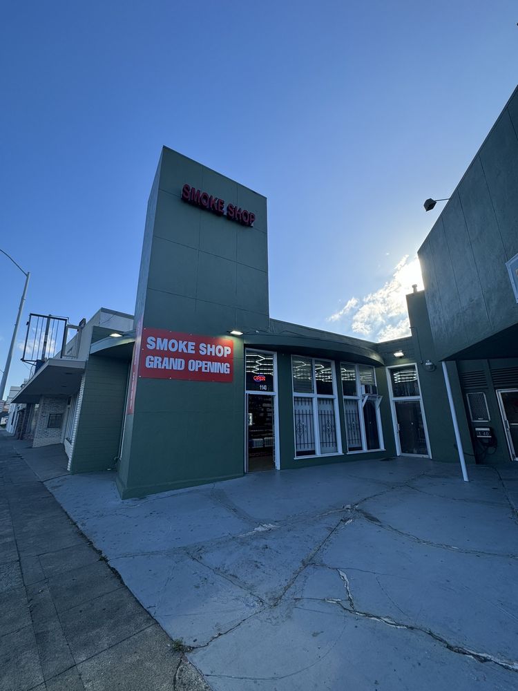 San Carlos smoke shop Logo