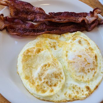 Rivers Edge Cafe - Eggs and bacon that came with the waffles.  Roomie loved the bacon and the egg was cooked the way I like it.  Over easy - American Near Me - Sacramento, California