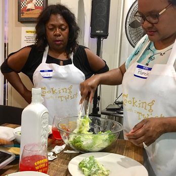 Cooking With A Twist - Tossing in Homemade Caesar Salad Dressing while searing shrimp to top it with. Seasoned to taste! - Cooking Classes Near Me - Stafford, Texas