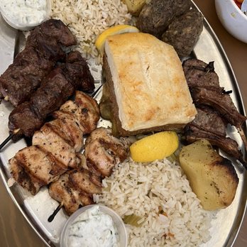 Zythos Greek Mediterranean Grill - Zythos Platter: lamb chops, beef and chicken souvlaki, moussaka, rice, potatoes, kefthedes, tzatziki. - Greek Near Me - Langley, British Columbia Zythos Greek Mediterranean Grill - Zythos Platter: lamb chops, beef and chicken souvlaki, moussaka, rice, potatoes, kefthedes, tzatziki. - Greek Near Me - Langley, British Columbia