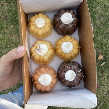 Bundts On Melrose - a person holding a box of doughnuts - Desserts Near Me - Long Beach, California