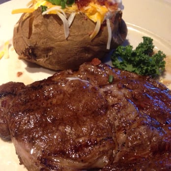 The Chop House - 10 oz ribeye and loaded baked potato - Steakhouses Near Me - Sevierville, Tennessee The Chop House - 10 oz ribeye and loaded baked potato - Steakhouses Near Me - Sevierville, Tennessee
