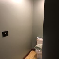 Garcia Paint - Wall repair, nails from bathroom tile installation on other side poking through.