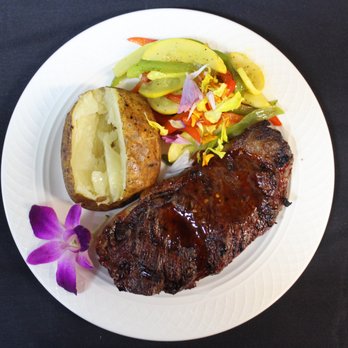 Rumors Bar & Bistro - a plate of steak, potatoes, and vegetables - Bars Near Me - Crystal River, Florida Rumors Bar & Bistro - a plate of steak, potatoes, and vegetables - Bars Near Me - Crystal River, Florida