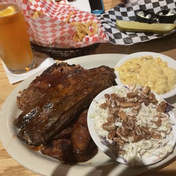 Bobby Q - 3-meat combo: spicy sausage, beef rib, brisket. Coleslaw and mac & cheese. Steak sandwich in distance. - Barbeque Near Me - Phoenix, Arizona Bobby Q - 3-meat combo: spicy sausage, beef rib, brisket. Coleslaw and mac & cheese. Steak sandwich in distance. - Barbeque Near Me - Phoenix, Arizona