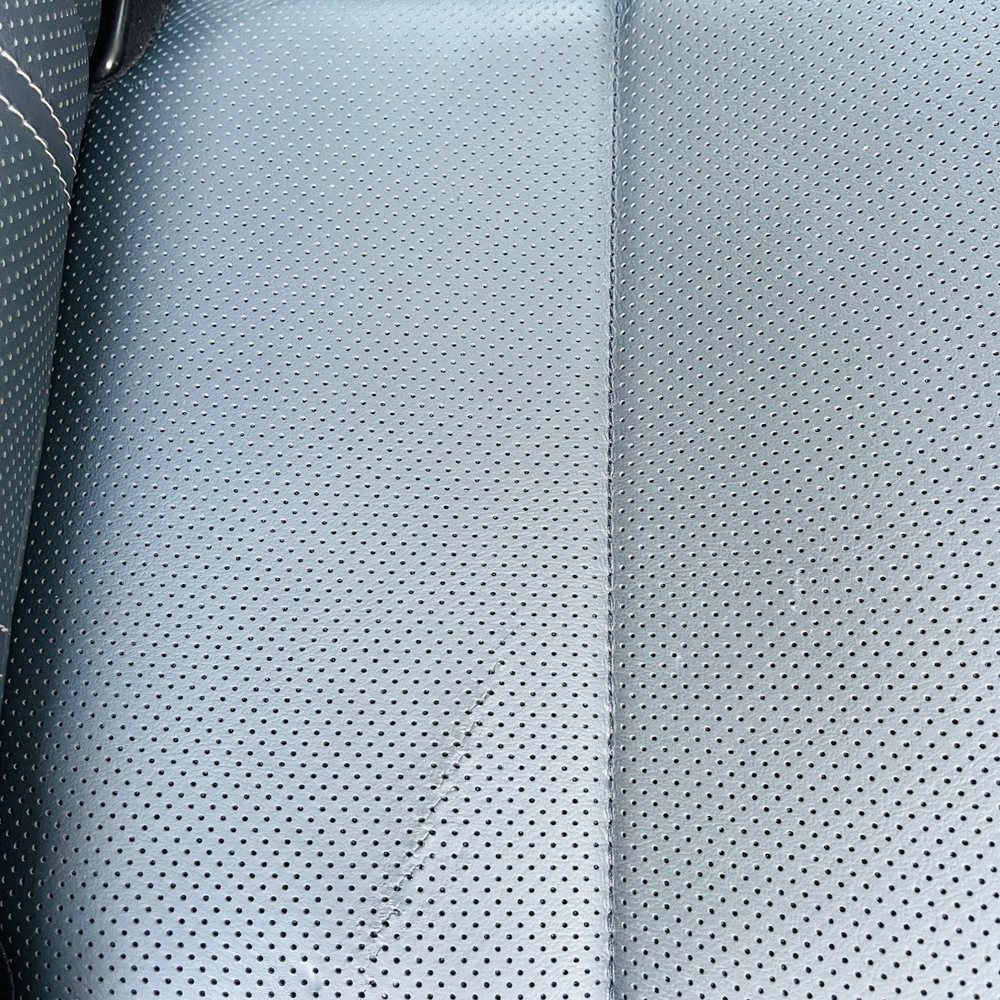 Advanced Interior Restoration Services - Before repair of panel on 2nd row seat. It's a cut in the leather. - Auto Upholstery Near Me - Modesto, California Advanced Interior Restoration Services - Before repair of panel on 2nd row seat. It's a cut in the leather. - Auto Upholstery Near Me - Modesto, California