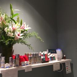 A Beautiful You - Congratulatory flowers with retail product in the pedicure area.