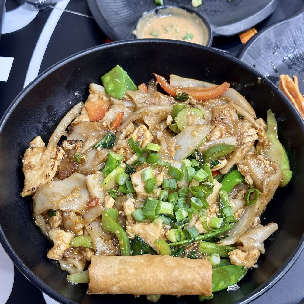 Wok to Bowl - Chicken Pad see ew with a spring roll - Pan Asian Near Me - Bloomington, Illinois Wok to Bowl - Chicken Pad see ew with a spring roll - Pan Asian Near Me - Bloomington, Illinois