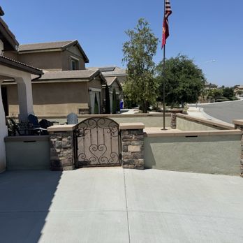 QTC Landscape Construction - Driveway widening, custom gate, stucco wall, stone columns, and lighting. - Artificial Turf Near Me