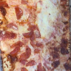 Brozzetti's Pizza - A half sheet cheese pizza with half pepperoni & the whole thing extra cheese.