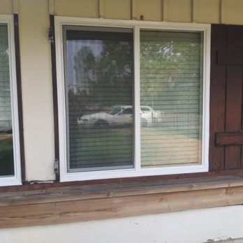 Alberte Construction - a window with shutters open - General Contractors Near Me - Sacramento, California