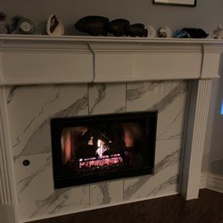 The Firehouse - NEW fireplace logs, glass beads & remote!  Working much better now.   We also updated the tile!  We are very happy and warm!