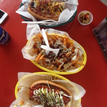 Dat Dog - Top: alligator sausage, middle: cheese fries w/bacon & ranch, bottom: duck sausage - Hot Dogs Near Me - New Orleans, Louisiana Dat Dog - Top: alligator sausage, middle: cheese fries w/bacon & ranch, bottom: duck sausage - Hot Dogs Near Me - New Orleans, Louisiana