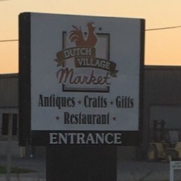 a sign for dutch village market