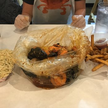 Kai's Crab Boil - From left to right: butter garlic noodles, kai's cajun pacific combo, and cajun fries - Seafood Near Me - Columbus, Ohio