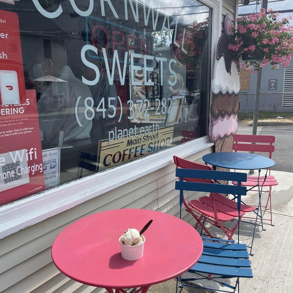a pink table and blue chairs