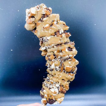 Balboa’s - The Gym Rat. Chocolate dipped frozen banana with chopped almonds and peanut butter drizzle. - Desserts Near Me - Mesa, Arizona