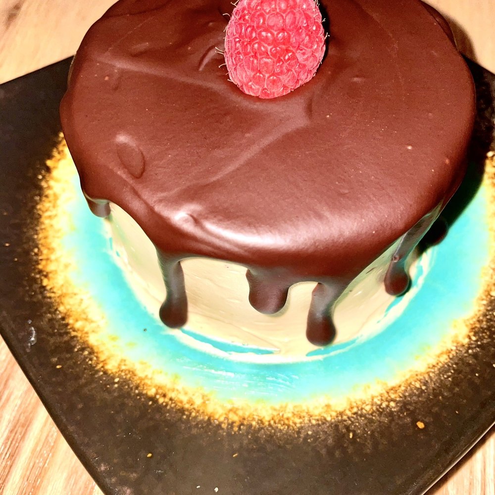 Grind - a chocolate cake with a raspberry on top - Cocktail Bars Near Me - Boyertown, Pennsylvania Grind - a chocolate cake with a raspberry on top - Cocktail Bars Near Me - Boyertown, Pennsylvania