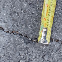 Manor Paving - .25 inch crack over 8ft long in my 2 year old driveway