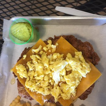 Nest Burger - Top down view of my amazingly delicious honey-drenched Fried chicken sandwich with scrambled eggs and cheddar cheese. - Burgers Near Me - Plano, Texas Nest Burger - Top down view of my amazingly delicious honey-drenched Fried chicken sandwich with scrambled eggs and cheddar cheese. - Burgers Near Me - Plano, Texas
