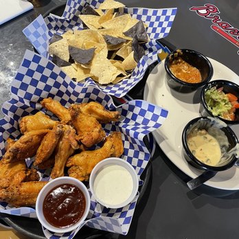 Turquoise Desert - a plate of fried chicken wings and dippings - Sports Bars Near Me - Rio Rancho, New Mexico