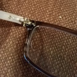 Eye to Eye Vision Center - Oversize screw. Gouge in lens. Photo does not fully show damaged lens.