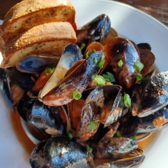 Nicks Fish House - 1/2lb steamed mussels + 1/2lb steamed clams in chipotle lime sauce, $17. - Seafood Near Me - Baltimore, Maryland