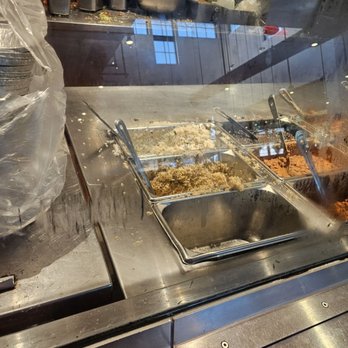 Chipotle Mexican Grill - Food all over the place in the front serving area AND also in the back prep area! I can just imagine what the back and the floor is like! - Fast Food Near Me - Chicago, Illinois