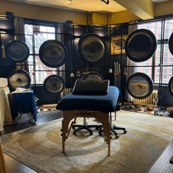 Chiron Acutherapeutics - Studio set up for an Acutonics® sound healing session with massage table.