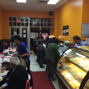Sagar Ratna - people sitting at tables in a restaurant - Indian Near Me - Queens, New York Sagar Ratna - people sitting at tables in a restaurant - Indian Near Me - Queens, New York