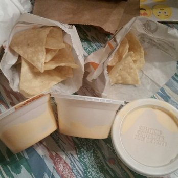 Taco Bell - Half filled nachos with half filled cheese sauce. - Fast Food Near Me - Carson, California