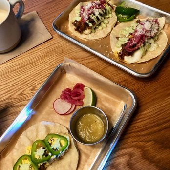 Pepita Coffee - A potato- and dairy-less chorizo + egg taco (corn tortilla), w/ the regular chorizo+egg and carnitas+egg tacos in the back / July 2019 - Coffee & Tea Near Me - Cambridge, Massachusetts