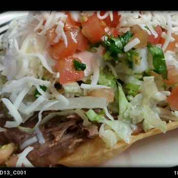 Macias El Michoacano - Shredded beef tostad topped with lettuce, freah tasty pico de gallo and monterrey jack cheese - Mexican Near Me - Cottonwood, California Macias El Michoacano - Shredded beef tostad topped with lettuce, freah tasty pico de gallo and monterrey jack cheese - Mexican Near Me - Cottonwood, California