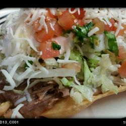 Macias El Michoacano - Shredded beef tostad topped with lettuce, freah tasty pico de gallo and monterrey jack cheese