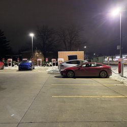 Tesla Supercharger Station in Coralville, IA. Located in the parking lot of Hy-Vee.
