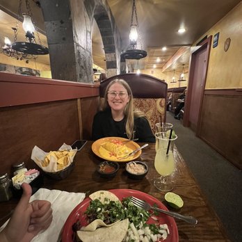 Mi Mexico Restaurant - a woman sitting at a table with a plate of food - Mexican Near Me - Colorado Springs, Colorado Mi Mexico Restaurant - a woman sitting at a table with a plate of food - Mexican Near Me - Colorado Springs, Colorado