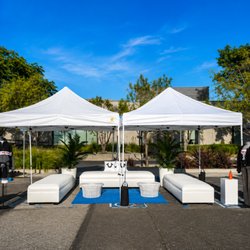 Tlapazola Event Rentals - Outdoor lounge setup with canopies and modern event furniture.