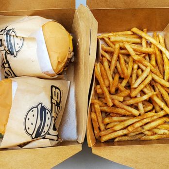 Joe's Burgers - The full spread (two classic cheeseburgers, one with no cheese, along with fries) - Fast Food Near Me - Kirkland, Washington
