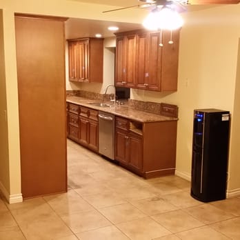 Sir G All Construction - Before picture of narrow galley kitchen and wall dividing the family room - General Contractors Near Me