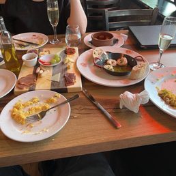 Meat and cheese board, shrimp, flambéed chorizo, patatas bravas, chicken/sausage/shrimp rice dish. SO GOOD Meat and cheese board, shrimp, flambéed chorizo, patatas bravas, chicken/sausage/shrimp rice dish. SO GOOD