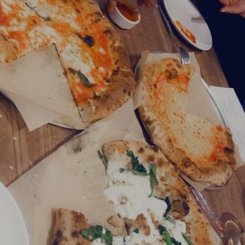 Bella Napoli - We tried a plain cheese, the Margherita, Sausage & Rapini (a little salty). Overall they were delicious! Drinks were tasty and strong - Italian Near Me - Schaumburg, Illinois
