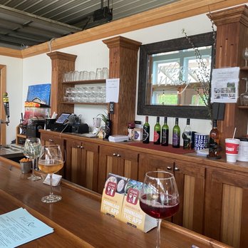 Wide River Winery - a bar with wine glasses on it - Wineries Near Me - Clinton, Iowa Wide River Winery - a bar with wine glasses on it - Wineries Near Me - Clinton, Iowa