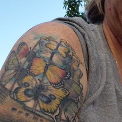 Trigger Happy Tattoo - Tyler Kinnaman, butterfly ship painting. 10 year old tattoo with only 2 touch ups.