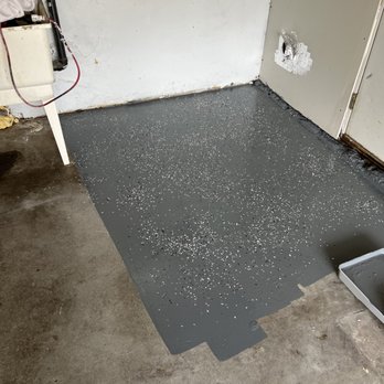 Tinos Luxury Flooring - a concrete floor being painted - Flooring Near Me Tinos Luxury Flooring - a concrete floor being painted - Flooring Near Me