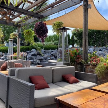 The Yard - a patio with a couch and tables - Lounges Near Me - Milwaukee, Wisconsin