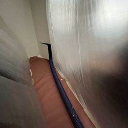 Attic Advisor - Protecting my home from insulation debris while they cleaned out the attic.
